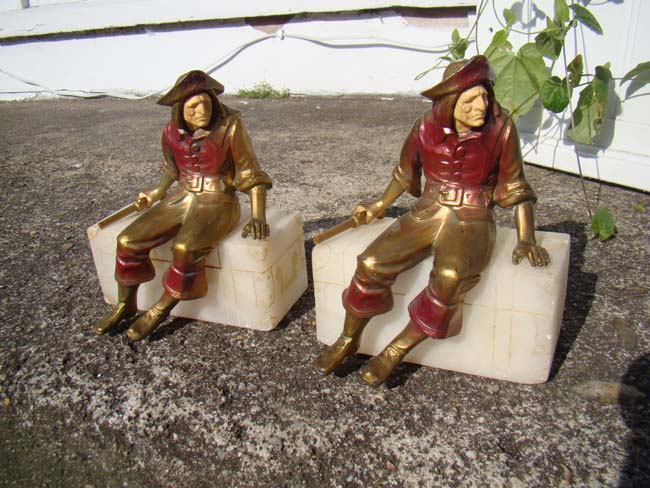 A charming pair of Pirate sitting on a treasure chest bookends circa 1928